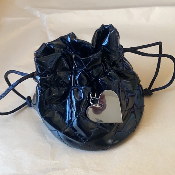 11:01  - 3/$25 Bundle Only GUESS Patent Drawstring Pouch - Picture 3 of 11